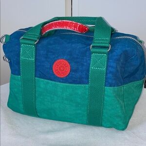 Kipling Hand Bag in Blue and Green with Red Accents